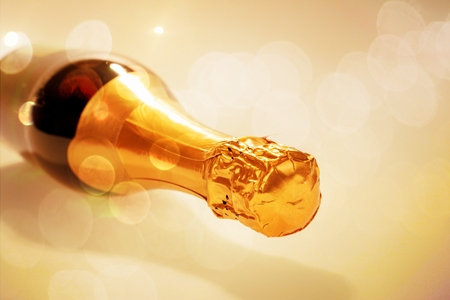 Lying new champagne bottle isolatedの写真素材