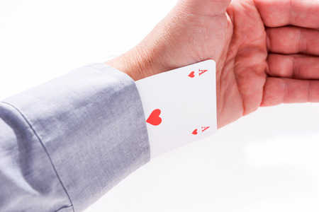 Card ace of hearts from the sleeve of shirt isolated