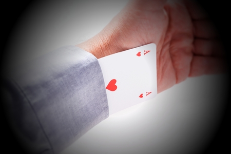 Card ace of hearts from the sleeve of shirt isolatedの写真素材