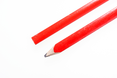 Two red construction pencils isolated on white backgroundの写真素材