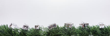 Christmas decoration with copy space. Christmas garland with silver gift boxes