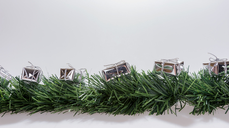 Christmas decoration with copy space. Christmas garland with silver gift boxesの写真素材