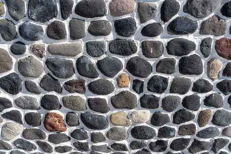 Stone background of smooth and dark stones