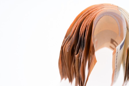 Many fifty euro banknotes isolated on white backgroundの写真素材