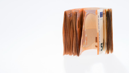 Many fifty euro banknotes isolated on white background