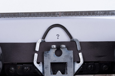 Concept image with question mark written on an old retro typewriterの写真素材