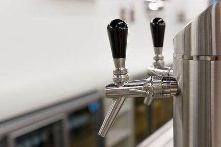 Silver beer taps in a pub. Selective focusの写真素材