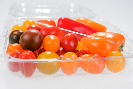 Mini vegetable mix with peppers and cherry tomatoes in plastic boxの写真素材