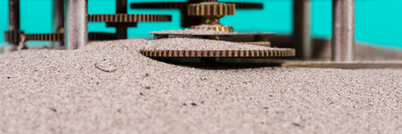 Gear wheels in the sand, sand in the gearboxの写真素材