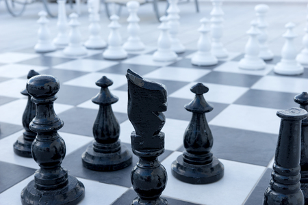 Large chess pieces on the outdoor terrace. Outdoor chess gameの写真素材