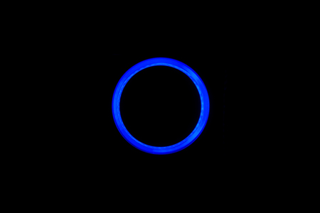 Blue neon circle isolated on black backgroundの写真素材