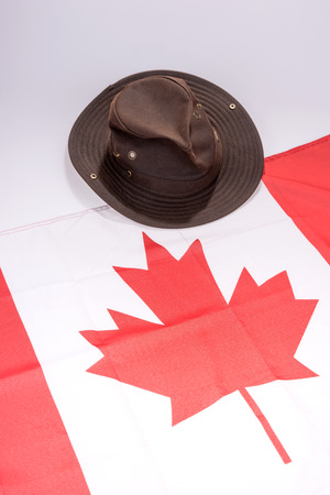 Canada national flag background with brown cowboy hatの写真素材