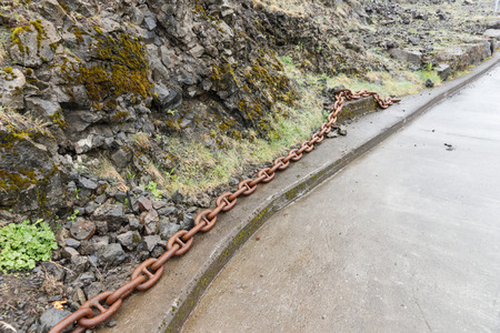 Big rusty chain left. Closely and inseparably connected