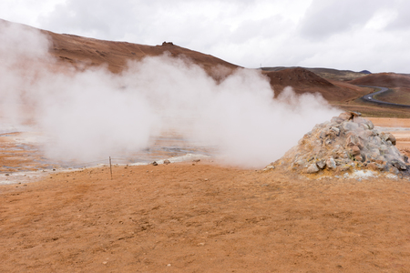 Steaming sulfur fumaroles at geothermal area Hverir in north Icelandの写真素材