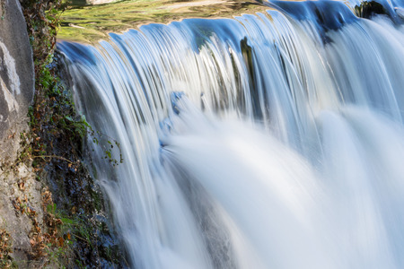 Long time exposure on the waterfall with stone cascade