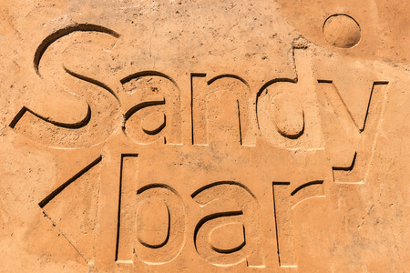 Sandy written in the sand on the beachの写真素材