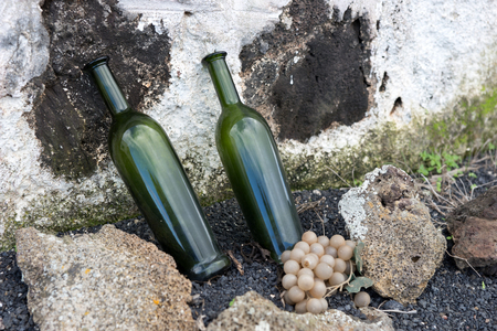 Two empty wine bottles advertising in front of the winery in Lanzaroteの写真素材