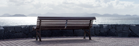 Empty bank on the coast of Lanzarote, overlooking the island of Fuerteventura. Canary Islandsの写真素材