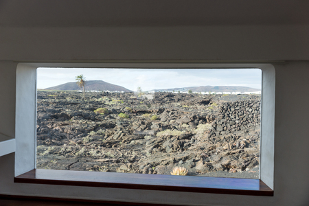Looking through the window at the lava. Lanzarote. Canary Islands. spainの写真素材