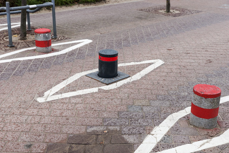 Three retractable electric bollard. Hydraulic bollard goes down the ground for the opening of...