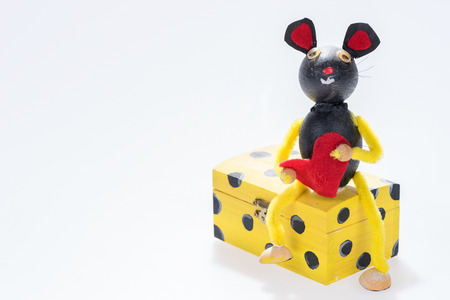 Mouse with red heart sits on the boxの写真素材