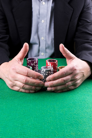 Man wins the poker game and gets the jackpotの写真素材
