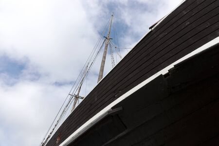 Mast of an old wooden sailboat. Detail of the old ship