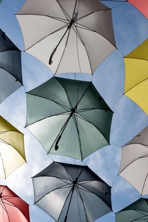 Colorful umbrellas in the sunshine. Rue du Cul-de-Sac, in the Quartier Petit Champlain, in Quebec Cityの写真素材