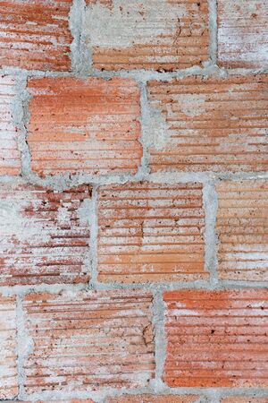 Closeup of new red brick wall in a newly built house