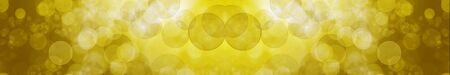 Big yellow panoramic bokeh background of glittering lightsの写真素材