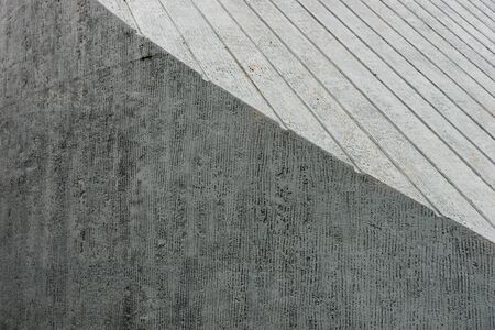 Light gray and dark gray textured concrete wall background. Gray textureの写真素材