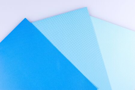 Blue background. Three separate shades of the blue