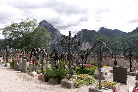 Cemetery with a view of the lake and the mountainsの写真素材