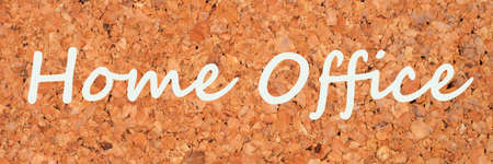 Home office lettering on a cork pin board