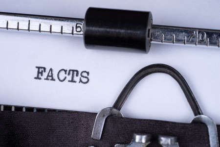 The word Facts written on an old typewriterの写真素材