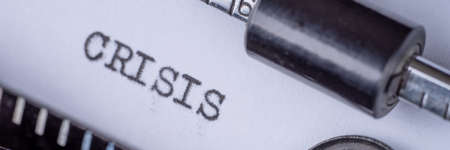 Crisis typed on retro typewriter. Panoramic imageの写真素材