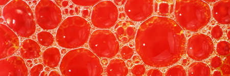 Water bubbles abstract red background, texture, patternの写真素材