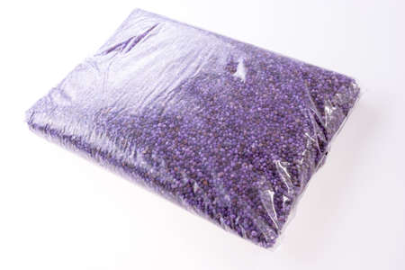 Purple mineral fertilizer for the lawn in the garden in the plastic bag