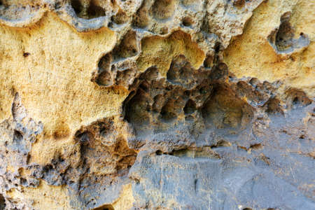 Close-up of holey natural sandstone rocks. Sandstone backgroundの写真素材