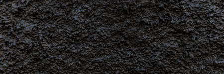 Black panoramic background. Grain black painted wall texture background