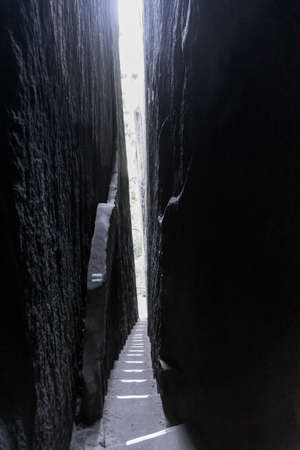 Crevice in the rock. Narrow path through the majestic sandstone rock walls. Adrspach rock city,...