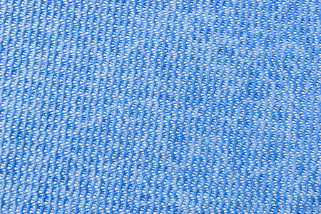 Blue plastic background with holes. Blue pattern