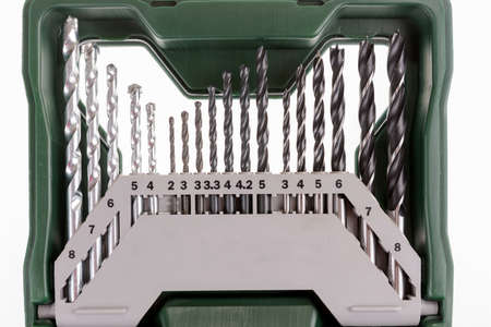 Set of drills, for metal, stone and wood in a green plastic box