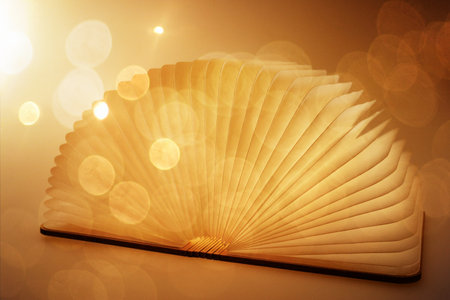 Open book with a magical fantasy. The magical power of reading and words. Fantasy backgroundの写真素材