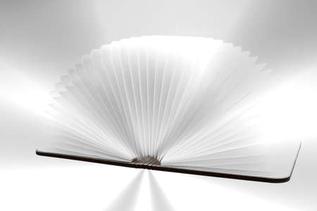 Open book with white blank pages and rays of lightの写真素材
