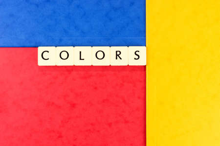 The word Colors on a red, yellow and blue background. Colorful backgroundの写真素材