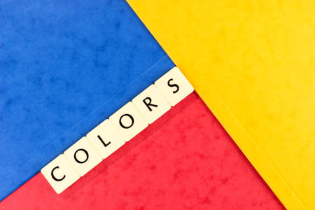 The word Colors on a red, yellow and blue background. Colorful backgroundの写真素材
