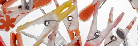 Colorful plastic clothespins isolated on white background. Panoramic imageの写真素材