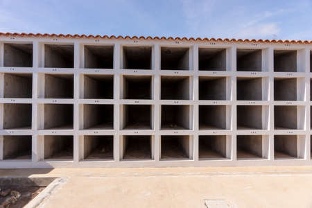 Empty grave sites with numbers in the cemetery. Canary Islands