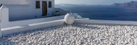 White ceramic vase on the terrace. Panoramic image